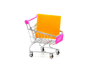 Sticky note and shopping cart isolated and white background.