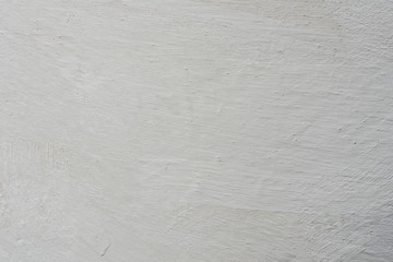 Texture of a concrete wall with cracks and scratches which can be used as a background