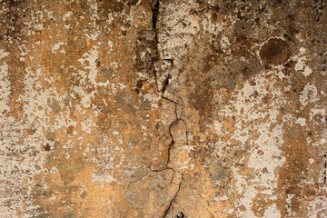 Texture of a concrete wall with cracks and scratches which can be used as a background