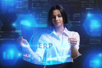 The concept of business, technology, the Internet and the network. A young entrepreneur working on a virtual screen of the future and sees the inscription: ERP