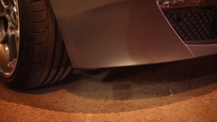 car's air suspension system back view, video in the evening.