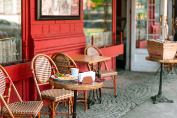Entrance to the cafe with table in the street