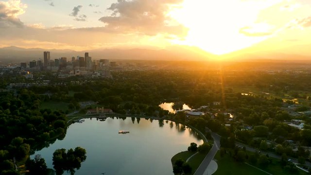 Aerial Drone Timelapse - Skyline of the city of Denver Colorado at sunset, from City Park.  