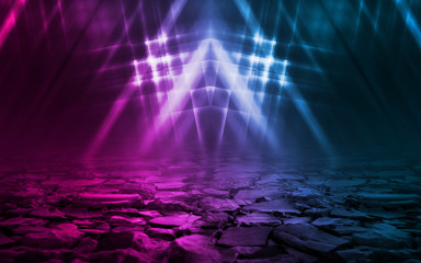 Empty background scene. Dark street reflection on wet asphalt. Rays of neon light in the dark, neon figures, smoke. Background of empty stage show. Abstract dark background.