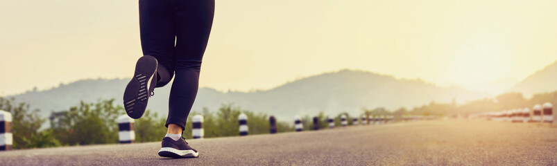 close up of woman leg in running start to reach the goal. Jogging workout and sport healthy...