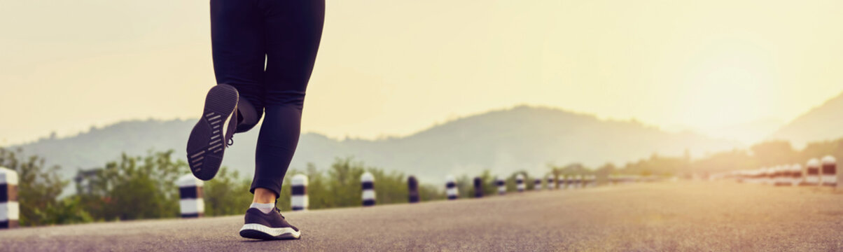 close up of woman leg in running start to reach the goal. Jogging workout and sport healthy lifestyle concept. proportion of the banner for ads.