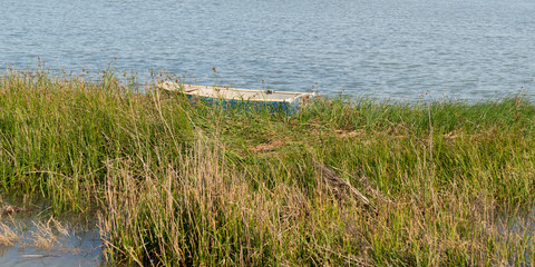 Obraz na płótnie Canvas wooden boat in Lacanau France lake in summer on web template banner header