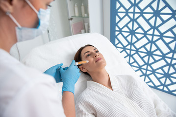 Obraz premium Young female ready for beauty procedure of face