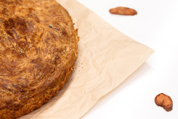  Freshly baked vegetarian pie homemade on craft paper.