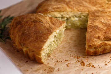  Freshly baked vegetarian pie homemade on craft paper.