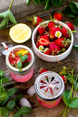 Fresh Strawberry lemonade on rustic wooden table.