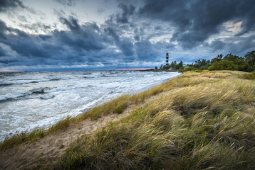 Thunderstorm over Baltic sea in a windy summer evening. Impressive waves hitting breakwater....