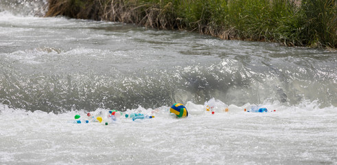 plastic garbage bottles on the river