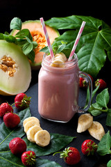 Delicious   smoothie with mint and fresh berries in glass  jar