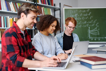 Group of young college students preparing for forthcoming seminar