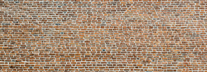 Brick wall, wide panorama of masonry. Wall with small Bricks