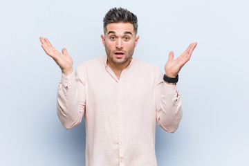 Fototapeta premium Young handsome cool man surprised and shocked.