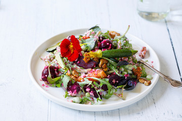 Bulgur wheat salad with roast beetroots, carrots, zucchini and green peas