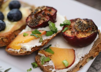 Dried piums with bread and soft cheese