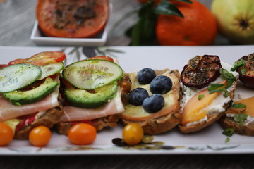 Dried piums with bread and soft cheese