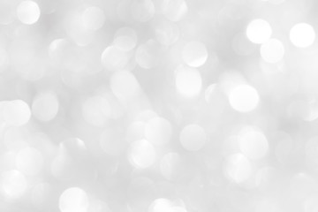 Obraz premium A brilliant white background with circles and ovals. Template for a holiday card with bright and sparkling lights.
