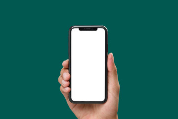 Hand holding the black smartphone with blank screen and modern frame less design on green colour background