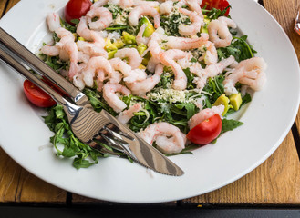 salad with avocado, greens and shrimps, healthy food