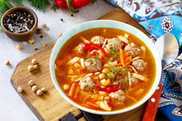Homemade Hot Soup with pasta, turkey meatballs and Peas Chickpeas. Eastern cuisine. The concept of healthy eating.