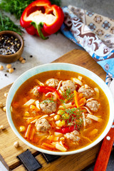 Homemade Hot Soup with pasta, turkey meatballs and Peas Chickpeas. Eastern cuisine. The concept of healthy eating.