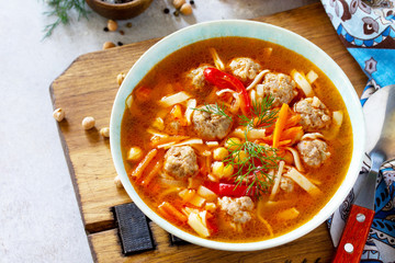 Homemade Hot Soup with pasta, turkey meatballs and Peas Chickpeas. Eastern cuisine. The concept of healthy eating.