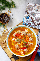 Homemade Hot Soup with pasta, turkey meatballs and Peas Chickpeas. Eastern cuisine. The concept of healthy eating. Top view flat lay background. Free space for your text.