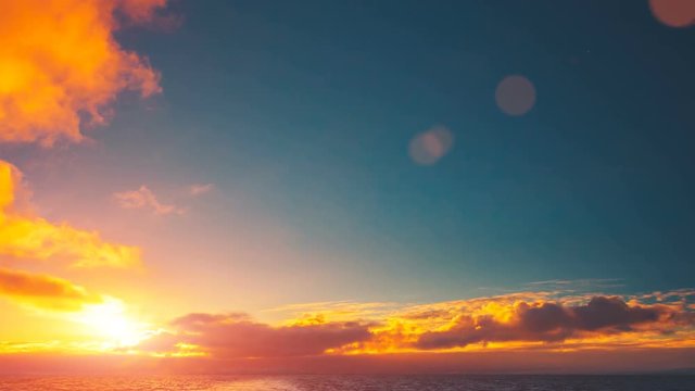 Beautiful cloudscape and sunset sun breaking through cloud over ocean water. Majestic nature landscape. Beauty world, holidays, sports and recreation. Travel background. Antarctica. Time lapse 4K