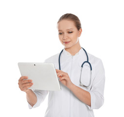 Portrait of medical doctor with stethoscope using tablet isolated on white
