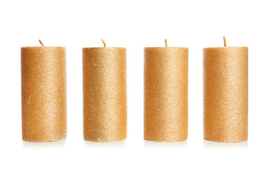 Stylish elegant gold candles on white background. Decor element