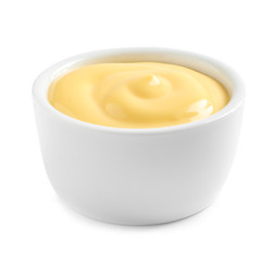 Delicious cheese sauce in bowl on white background