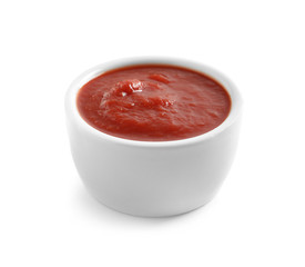Delicious tomato sauce in bowl on white background