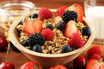 Cereal. Bowl of granola cereals, fruits and milk for breakfast. Muesli with cereals.