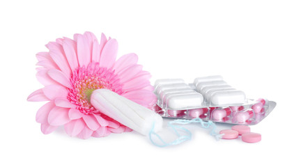 Fototapeta na wymiar Hygienic tampons, pills and flower on white background. Gynecology concept