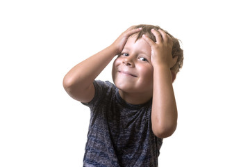 Portrait of an attractive little boy shocked, surprised, confused isolated on white background.