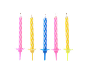 Color birthday cake candles on white background