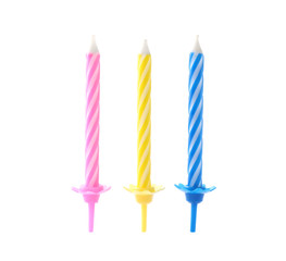 Color birthday cake candles on white background