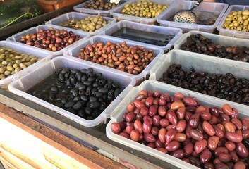 Variety of fresh olives for sale at farmers market 