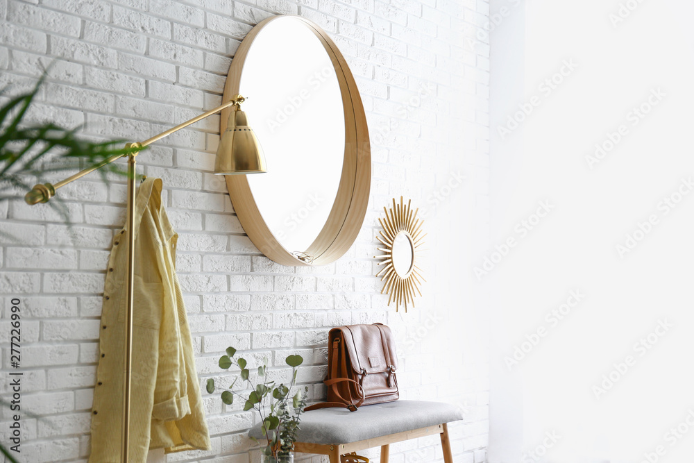 Canvas Prints Room interior with round mirror hanging on brick wall. Space for text