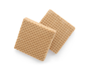Delicious crispy wafers on white background, top view. Sweet food