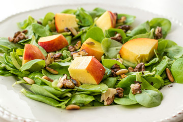 Purslane Salad with Peach Fruit, Roasted Walnuts and Pine Nuts.
