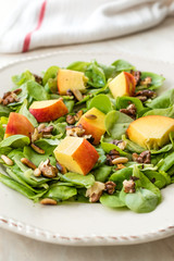 Purslane Salad with Peach Fruit, Roasted Walnuts and Pine Nuts.