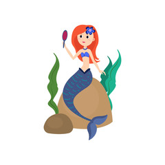 Cute red hair mermaid looking in hand mirror