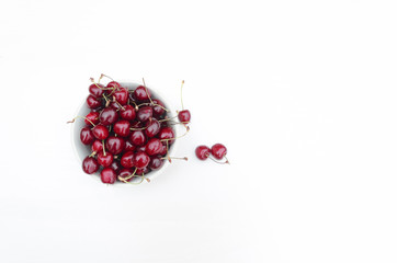 Flat lay fresh ripe sweet cherry in a glass plate. cherries. cherry on the bowl on white background. Cherry isolated. copy space.