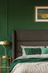 Close-up of green and gold bedroom interior