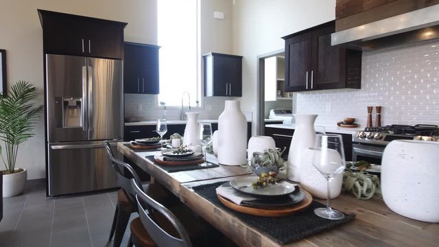 Kitchen Dining Room Table Move to Fridge. view moves forward along a dining table in the kitchen area
